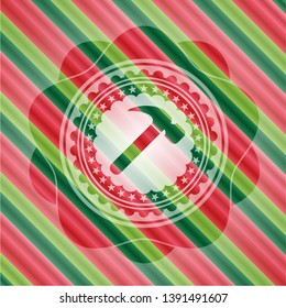 hammer icon inside christmas emblem background.