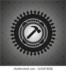 hammer icon inside dark badge