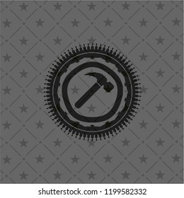 hammer icon inside dark badge