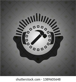 hammer icon inside dark badge or emblem