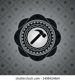 hammer icon inside dark badge
