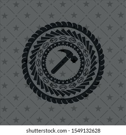 hammer icon inside dark badge or emblem