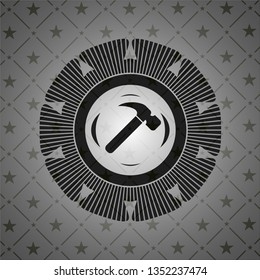 hammer icon inside dark emblem