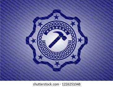 hammer icon inside denim background