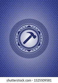 hammer icon inside denim background