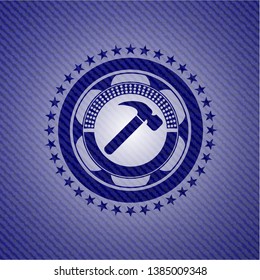 hammer icon inside emblem with jean high quality background