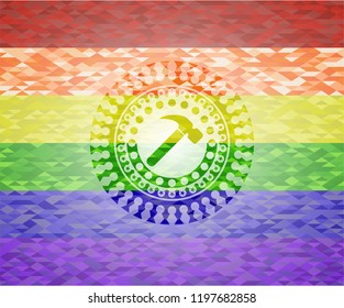  hammer icon inside emblem on mosaic background with the colors of the LGBT flag