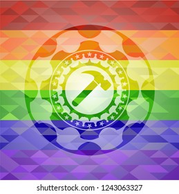 hammer icon inside emblem on mosaic background with the colors of the LGBT flag