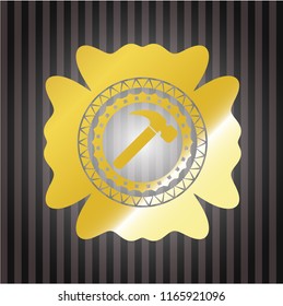 hammer icon inside gold emblem