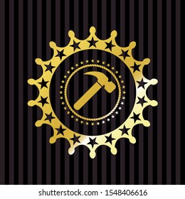 hammer icon inside gold emblem