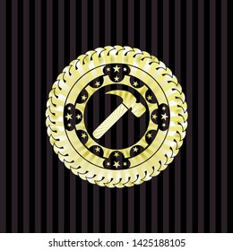 hammer icon inside golden emblem