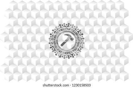 hammer icon inside grey badge with geometric cube white background
