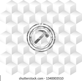 hammer icon inside grey badge with geometric cube white background