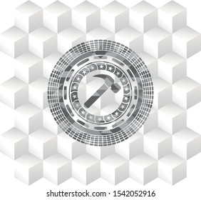 hammer icon inside grey badge with geometric cube white background