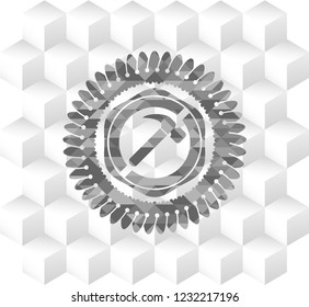 hammer icon inside grey emblem with cube white background