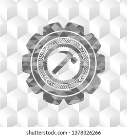 hammer icon inside grey emblem with cube white background
