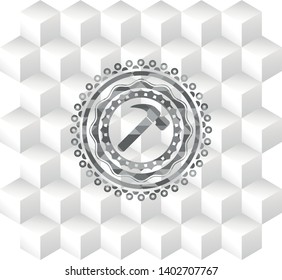 hammer icon inside grey emblem with geometric cube white background