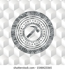 hammer icon inside grey icon or emblem with geometric cube white background