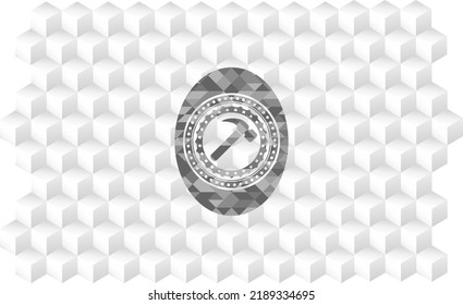 hammer icon inside grey emblem with geometric cube white background. 