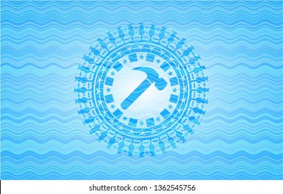 hammer icon inside light blue water wave badge.