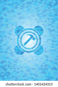 hammer icon inside light blue emblem with mosaic background