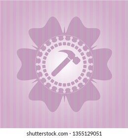 hammer icon inside pink emblem
