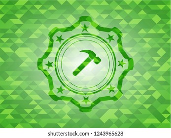 hammer icon inside realistic green emblem. Mosaic background