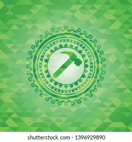 hammer icon inside realistic green emblem. Mosaic background