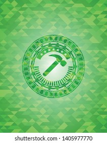 hammer icon inside realistic green mosaic emblem