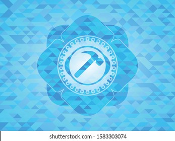 hammer icon inside realistic light blue emblem. Mosaic background