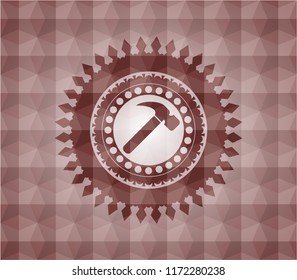 hammer icon inside red seamless emblem or badge with abstract geometric polygonal pattern background.
