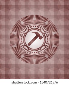 hammer icon inside red seamless geometric emblem.