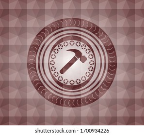 hammer icon inside red seamless emblem or badge with geometric pattern background.