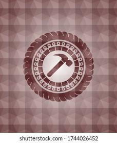 hammer icon inside red seamless badge with geometric pattern background. 