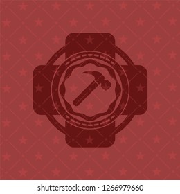 hammer icon inside retro red emblem