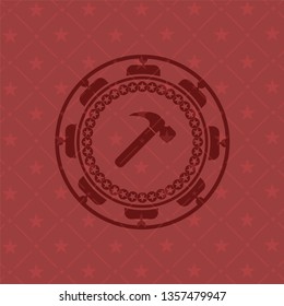 hammer icon inside retro red emblem