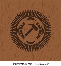 hammer icon inside retro style wood emblem