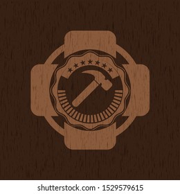 hammer icon inside retro wooden emblem