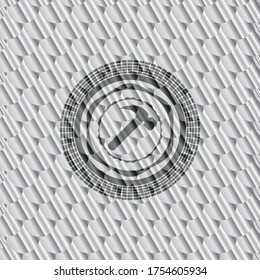 hammer icon inside shiny silver emblem. Scales pattern. Vector Illustration. Detailed. 
