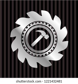 hammer icon inside silver badge or emblem