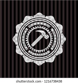 hammer icon inside silvery emblem or badge