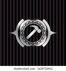 hammer icon inside silvery shiny emblem