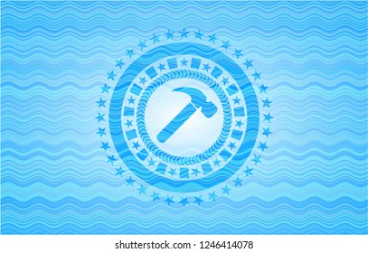 hammer icon inside sky blue water emblem.