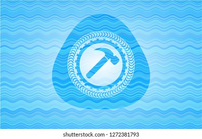 hammer icon inside sky blue water style badge.