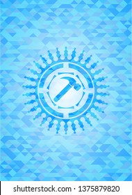 hammer icon inside sky blue mosaic emblem