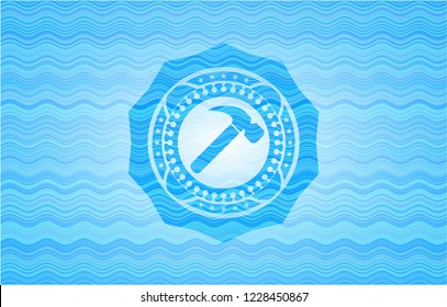hammer icon inside water wave representation emblem background.