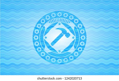 hammer icon inside water wave concept style badge.