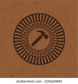 hammer icon inside wood emblem