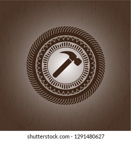 hammer icon inside wooden emblem. Vintage.