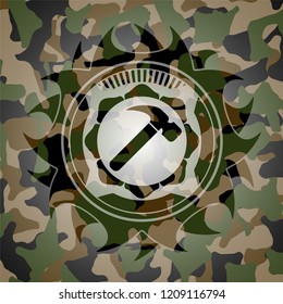 hammer icon on camo pattern